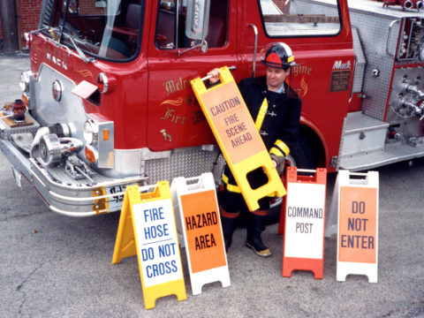 Fireman with minicade signs